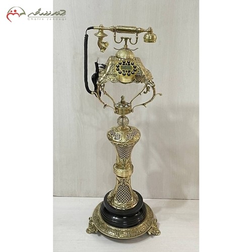 خرید آنلاین، تلفن ایستاده برنزی پر نق و نگار طرح ستون زنبوری برجسته و با پایه سنگی، طلایی رنگ، به قیمت تولیدی | هنرظریف