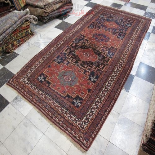 فرش دستباف آنتیک لري اولاد طرح ۴ ترنج سایز قالي رنگ زمینه سرمه اي رنگ حاشیه كرم کد ۳۹۷۰۶