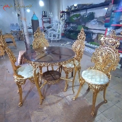 میز ناهار خوری 4 نفره برنزی با صفحه شیشه ای و پارچه درجه یک