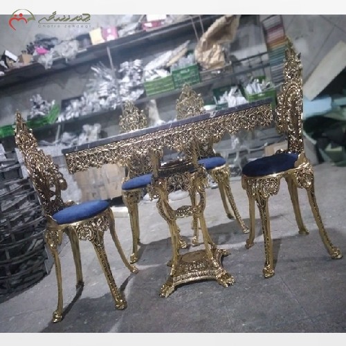میز ناهار خوری از جنس برنزی مدل پسر بچه و پایه اسبی با صفحه سنگ مشکی، با کیفیت عالی