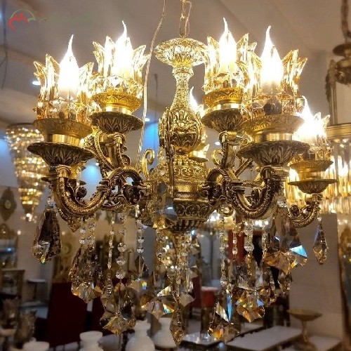 لوستر آلیاژ طلایی رنگ دارای 5 شاخه ی دوبل و سر شاخه های کریستالی، دارای ضمانت
