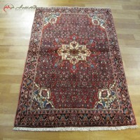 خرید آنلاین، فرش زیبای دستبافت بیجار کد 38992 با رنگ زمینه لاکی و حاشیه های پر نقش و نگار، زیر قیمت بازار | هنرظریف